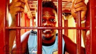 Hamzah (21) Imigran asal Afganistan menunjukkan ekspresinya saat diambil ambil gambarnya